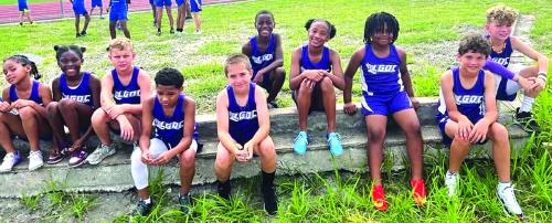 Some of the La Grange Optimist Club athletes relax during a break in action at the Flatonia meet earlier this year. La Grange Optimist Club photo