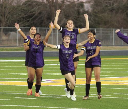 The five La Grange girls soccer players who were sent out for penalty kicks Friday react towards the sideline after they won. Front row, left to right – Kaylee Soto (who had a goal in regulation and then scored her PK) and Riley Lowe (who scored the game-winning PK). Back row, Michelle Leal (who didn’t need to kick because the Leps were already up 3-0), Trinity Yanis (who scored on her PK) and Florencia Barron. Photo by Jeff Wick