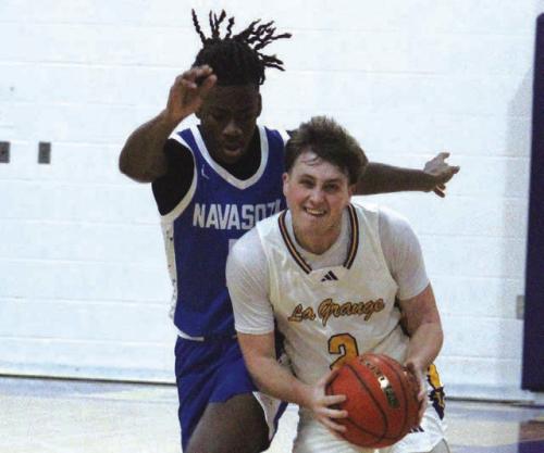 La Grange’s Caleb Norwood handles the ball Tuesday facing some tough defense from Navasota. Photo by Jeff Wick
