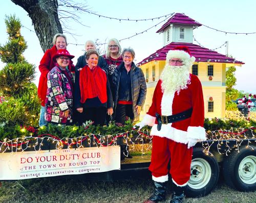 Pictured back from left: Holly Johnson, Judy Van Zandt, Dayna Davenport; front row: Debbie Koenig, Jeannette Preuss, Kathy Schatte, and Santa Claus.