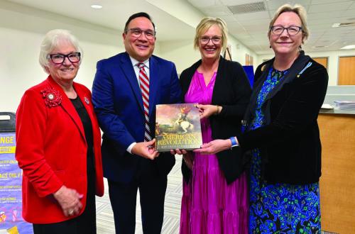 Pictured at the time of the donation are (from left) Carolyn Caflisch, Smith-McMillan Chapter Regent; John Pineda, Principal LHS; Pam Keilers, 7th-12th Grade Library Staff; and Kim Joost, Smith-McMillan Chapter Librarian.