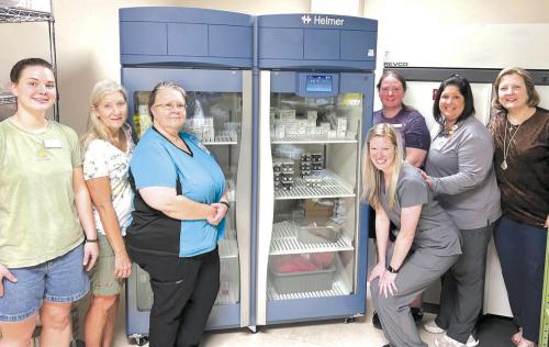 Second Chance Funds New Laboratory Refrigerator For St. Mark’s Medical Centerr; Gayle Schielack, SCE Store Director; Stacey Weyenberg, MLT, St. Mark’s; Valerie Otto, MT, St. Mark’s; (back row) Stacy Cada, SCE Asst. Store Director; Amanda Fuchs, MT, Director, St. Mark’s Laboratory Services; and Linda Morrison, SCE Board Secretary.