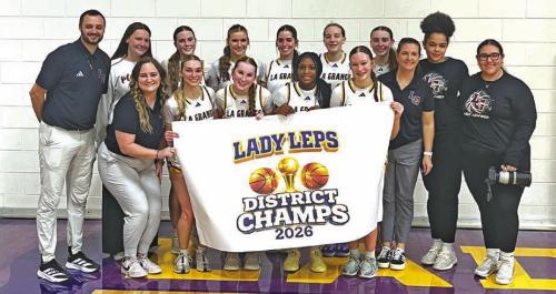 The members of the La Grange girls basketball team celebrate their district title at the conclusion of Tuesday’s win over Navasota. Photo by Jeff Wick