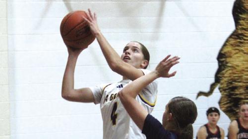 La Grange’s Macie Collier goes up a basket earlier this season. Photo by Jeff Wick