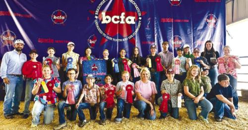 Pictured front from left: Kinley Kutac, Tate Fritsch, Joe Carrales, Emma Zweschper, Abigale McBride, Coach Kaci Carrales, Hudson Holub, Hayleigh Pizzitola, and Hunter Gabler; back row: Coach JoJo Carrales, Crockett Guenther, Laramie Laake, Tatum Fritsch, Alexis Berckenhoff, Kaisley Janecka, Adalyn Carrales, Addison Berckenhoff, Holden Holub, Kullen Kutac, Dylan Zweschper, Hailey Janish, Abraham McBride, Madyson Holub, and Julia Melton.