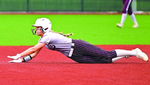 Flatonia’s Kara Croyle dives into second base on a steal in the 4th inning of play against Charlotte in the area round playoff series last week. Photo by Stephanie Steinhauser