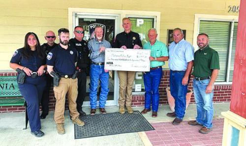 Tri-County Friends of the NRA presented a grant to the Flatonia Police Department for the purchase of new patrol rifles. Pictured are Officer Taylor Amos, Officer Wilbert Kalina, Sergeant Trey Tunis, Officer Jason Bellah, Flatonia City Manager Raymond Miller, Chief Lee Dick, and Tri-County Friends of NRA representatives Dennis Brower, Craig Schulz, and Jeremy Stoever.