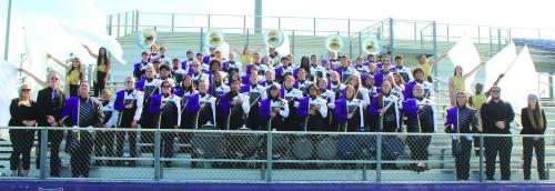 The La Grange High School band got all dressed up for their group photo day last Thursday at Leopard Stadium as they continue to prep their halftime show. This year’s halftime show is called “Flower Power” and will include vibrant pop sounds of the late 1960s and early 1970s. The drum majors this year are seniore Chloe Coufal and Kameron Behrens. Photo by Jeff Wick