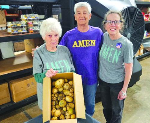 Martin Payne's donation from our community garden to AMEN received by Sharon, Janie and Susan.