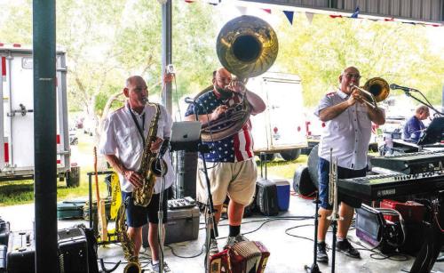 The Dujka Brothers – Mark (left) and John (right) – performed with Mason Nesvadba to kick off the St. John Picnic. Photos by Andy Behlen