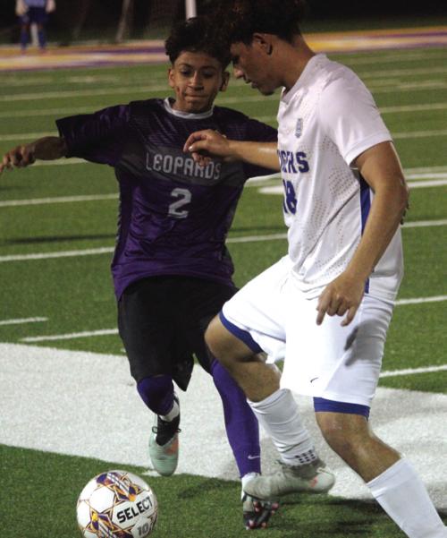 La Grange’s Jared Hernandez, left, fights for control of the ball in Tuesday’s match. Photo by Jeff Wick