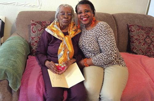 This photo shows Frances Scott, 98-years-old, left, getting a Thanksgiving Blessing gift card from Bethlehem AME Church, presented by Janette McKenzie, church secretary, right. The church gave out three other blessing cards, not pictured.