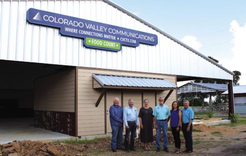 Left to right, by the new sign at the fairground food court: John Wied-Attorney, Gene Kruppa-CVCTX Board President, Karen Gunkel-CVCTX Director of Regulatory Affairs &amp; Marketing, Michal Zuhn-Fair Board President, Amber Sternadel-Customer Relations Supervisor, and Kelly Allison-CVCTX General Manager.