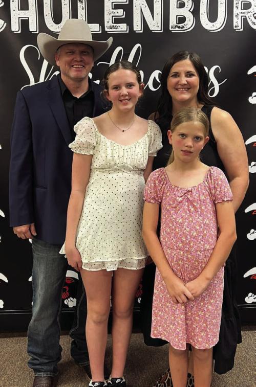Schulenburg ISD welcomed new athletic director and head football coach Clay Ferguson at a special school board meeting last Friday, March 7. He is pictured here with his wife Stephanie and their daughters Paisley and Hadley.