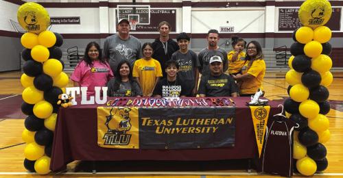 Flatonia star sprinter Luis Vela has signed a letter of intent to run track at Texas Lutheran University in Seguin. Vela is shown here at his signing ceremony front and center, along with family and coaches.