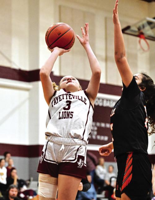 Fayetteville’s Scotti Beseda goes up for a shot in Friday’s Flatonia Tournament game against Smithville. The Lady Lions went 1-3 at the tourney, losing to Giddings, Smithville and East Bernard but beating the Victoria East JV 43-20. Paige Jurecka scored 11 points and Devynn Moeckel scored 10 in that victory. Photo by Stephanie Steinhauser