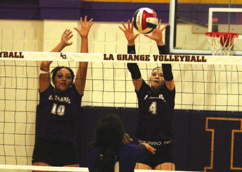 La Grange’s Cara Homer and Avery Griffin go up for a block in Friday’s match. Photos by Jeff Wick