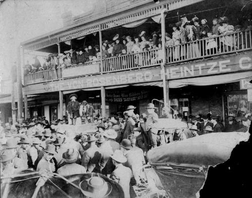 A large crowd gathered in front of the Von Rosenberg-Heintze Company at 345 and 353 West Travis Street in La Grange on March 5, 1908, to see Buster Brown and his dog pal, Tige. August Heintze is the bearded man on the balcony. Photo courtesy of the Fayette Heritage Museum &amp; Archives