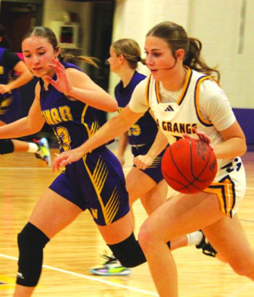La Grange’s Campbell Cooper drives the ball down the court Friday. Photo by Jeff Wick