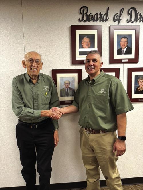 Bank President Chris Coufal, right, honored Gilbert Krause’s contributions with a retirement celebration held on the bank’s second floor.