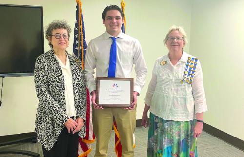 Lois Wink, Flag of the United States Committee Chair, Cole Stork, and Kim Joost, Parliamentarian filling in for the Regent.