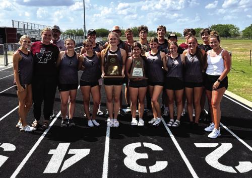 Members of the Fayetteville track team hold their area team title trophies after the meet last week.