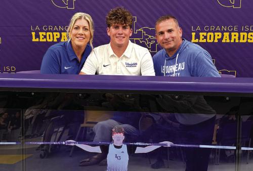 La Grange senior Cole Collier, center, inked a deal to pole vault for LeTourneau University in Longview.