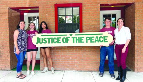 Elizabeth Faldyn, clerk, with students Reagan Moreau, Valerie Vera, Cooper Mau and JP Jamie Moreau.