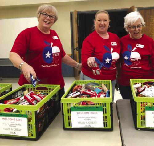 Terri Wagner, Lisa Slinkard and Carolyn McCrory prepare Goodie Baskets for educators.