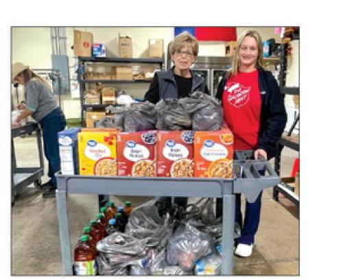 Sally Garrett and Krystal Segar dropped off donations to AMEN.