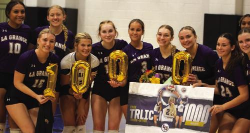 La Grange junior volleyball setter Kylie Trlicek recorded her 1,000th career assist last week in the Lady Leps’ regular season finale victory over Navasota. Trlicek, holding the flowers, is shown here celebrating with her teammates after that win. The Lady Leps face Sealy in the first round of the playoffs Monday at 6 p.m. at Rice Consolidated. Photo by Gabby Castillo