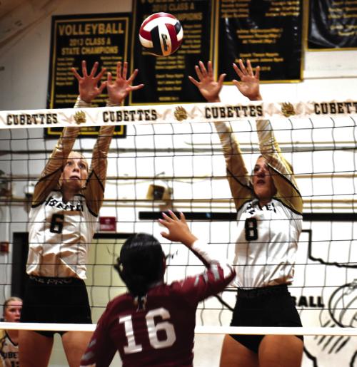 Round Top-Carmine’s Cayden Nelius and Bree Dooley jump to block this hit by Fayetteville’s Devynn Moeckel. Photo by Paul Kipp
