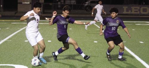 La Grange’s Nohe Maldonado, center, and Raul Macera, 10, try to stop this Cameron advance in Tuesday’s game. Photo by Jeff Wick