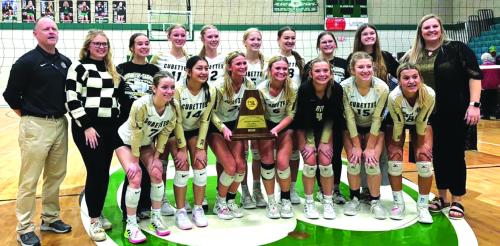 The members of the Round Top-Carmine volleyball team pose with their regional title trophy after Saturday’s victory.