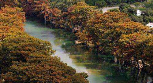 The trees along the Frio River at Garner State Park in Concan usually offer some stunning fall color this time of year. Photo courtesy of Texas Parks and Wildlife