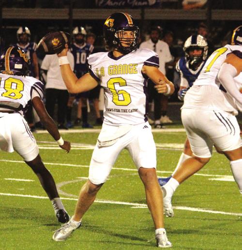 La Grange quarterback Clayton Cooper throws the football in Friday’s game. He ran for 200 yards and three touchdowns and threw for 113 yards and another score.