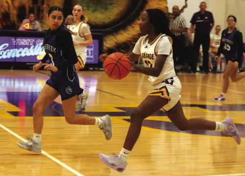La Grange’s Kaylee Holmes leads a fast break down the court during Tuesday’s victory over Cedar Creek. Photo by Jeff Wick