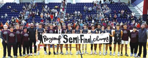 The members of the Fayetteville basketball team celebrate after Tuesday’s regional semifinal victory in the third round of the 1A playoffs in Madisonville.