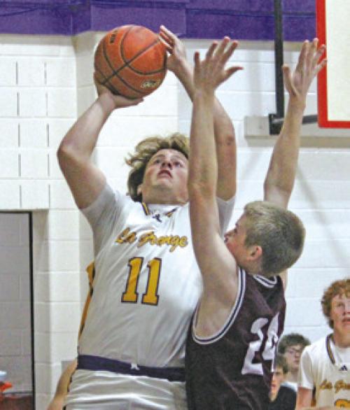 Christian Biles goes to the hoop in Tuesday’s win. Photo by Jeff Wick