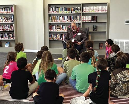 Mayor Mike Stroup reading to 4th graders as part of the Read Across America event in Fayetteville.
