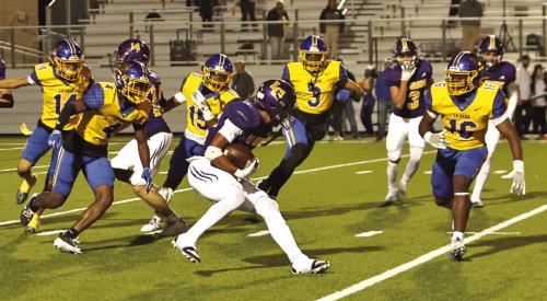 La Grange sophomore Dwodney Thompson is swarmed by Waco La Vega players as he tries to advance the ball Friday. Photo by Darrell D. Gest