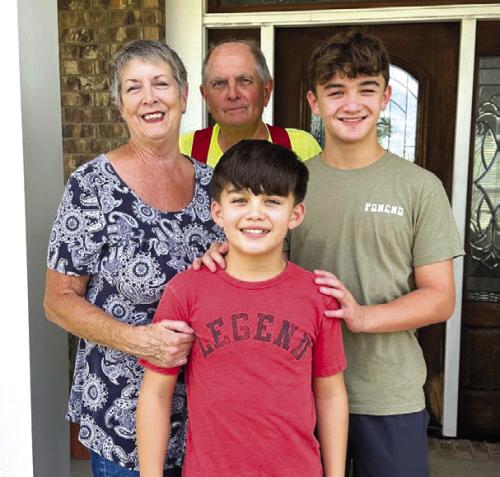Kathy and Frank Chlumsky and their grandsons Conner and Hunter.