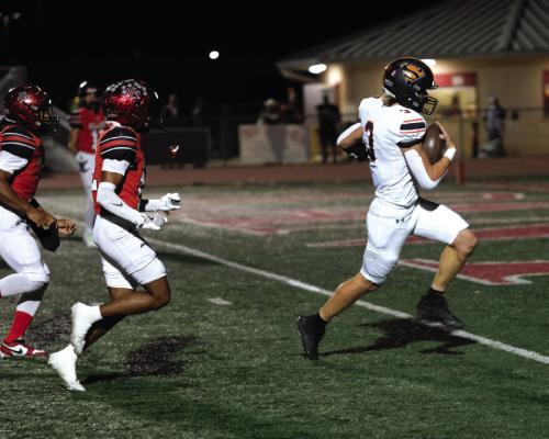 Schulenburg quarterback Aaron Janecek crosses the goal line on a keeper. Photo by Andy Behlen