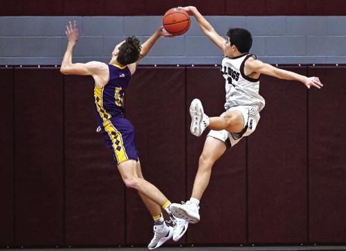 Caysen Perez denies Weimar a two point shot Friday night in Flatonia. Photo by Stephanie Steinhauser