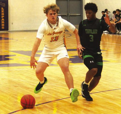 La Grange’s Conner Brooks drives to the basket in Tuesday’s win over Taylor. Photo by Jeff Wick