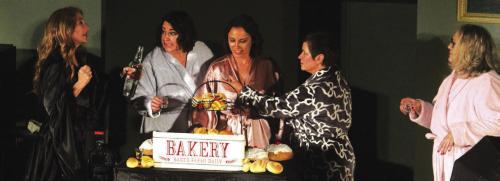 Some of the stars of “Calendar Girls” get some liquid courage in a scene before their calendar shoot. Left to right: Julie Couch, Lucy Carr, Staci Ulrich, Blythe Cone and Katy Beauford.