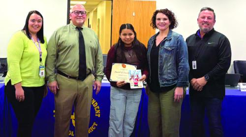 Nathalie Navarro, a 6th grader at La Grange Elementary was recognized at Monday night’s school board meeting for her Christmas card design. She is pictured here with her art teacher- Brittni Keilers, school board president-Gary Drab, principal-Dr. Regina Walker, and superintendent-Andy McHazlett.