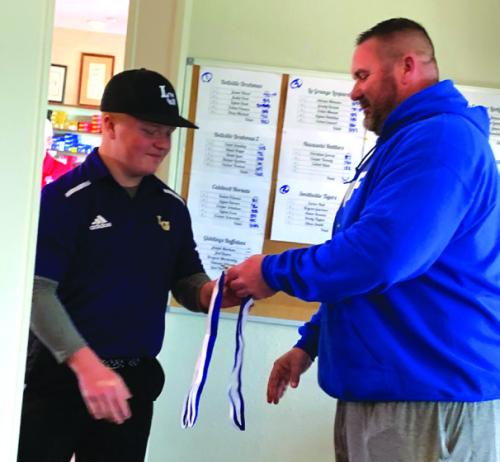 La Grange’s Grady Kocian receiving his 3rd place medal.