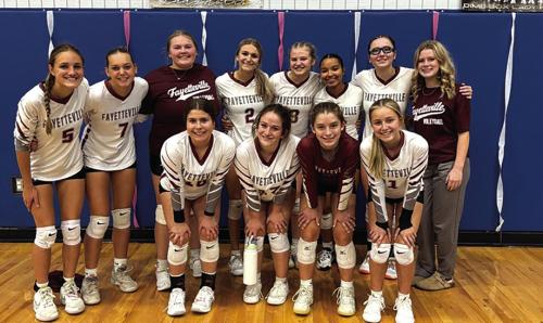 The members of the Fayetteville volleyball team pose after Thursday’s victory in the first round of the playoffs over Buckholts in Dime Box.