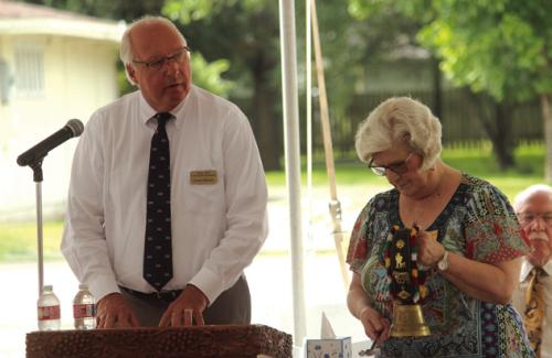 Dennis Zbranek reads the names of local veterans who had died since last Memorial Day, as Joan Miertschin strikes a bell after each name is read.